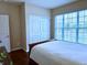 Bright bedroom featuring a large window, hardwood floors, and double door closet at , Noblesville, IN 46060