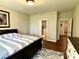 Cozy bedroom featuring hardwood floors, ensuite bath, and large windows at , Noblesville, IN 46060
