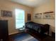Cozy bedroom with a single bed, window, and shelves featuring miniature architectural models at , Noblesville, IN 46060