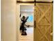 Exercise room featuring barn doors, fitness equipment, and natural light at , Noblesville, IN 46060