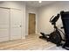 Fitness area with barn door, exercise equipment, double closet, and laminate floors at , Noblesville, IN 46060