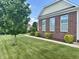 Well-kept brick exterior with manicured landscaping and a lush green lawn at , Noblesville, IN 46060