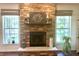 Close-up of stone fireplace with mantle, flanked by windows at , Noblesville, IN 46060
