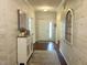 Bright foyer with hardwood floors, white wood-look paneling and stylish decor at , Noblesville, IN 46060
