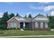Beautiful brick and stone home with a manicured lawn and mature trees at , Noblesville, IN 46060