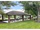 Community pavilion features brick columns, picnic tables, and ample seating for outdoor gatherings at , Noblesville, IN 46060