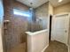 Contemporary bathroom featuring a glass-enclosed shower with tiled walls and multiple shower heads at , Noblesville, IN 46060