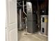 View of the utility room showing the hot water tank, furnace, and exposed ductwork at 11700 Harvest Moon Dr, Noblesville, IN 46060