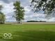 Expansive backyard with freshly mowed lawn and trees at 11898 N 200 W, Fountaintown, IN 46130
