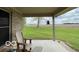 Inviting backyard patio featuring comfortable seating and picturesque views of the lush, expansive lawn at 11898 N 200 W, Fountaintown, IN 46130