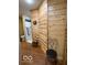 Bathroom featuring wood walls with a shower and toilet at 11898 N 200 W, Fountaintown, IN 46130