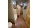 Spacious bathroom featuring a tiled shower, wood accents, and hardwood floors at 11898 N 200 W, Fountaintown, IN 46130