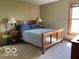 Cozy bedroom featuring a bed with nightstands and a window that lets in natural light at 11898 N 200 W, Fountaintown, IN 46130