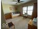 Bedroom featuring a daybed with decorative pillows and natural light from the windows at 11898 N 200 W, Fountaintown, IN 46130