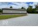 Gravel driveway leads to a metal sided barn style home at 11898 N 200 W, Fountaintown, IN 46130