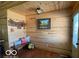 Cozy entryway with beautiful wood paneling, decor, and a charming bench at 11898 N 200 W, Fountaintown, IN 46130