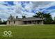 Charming single-story brick home with a lush green lawn and ample space at 11898 N 200 W, Fountaintown, IN 46130