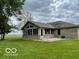 Back exterior of the home featuring a sunroom, and ample outdoor space at 11898 N 200 W, Fountaintown, IN 46130