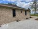 Charming exterior showcasing brickwork, complemented by attractive landscaping and a well-maintained gravel path at 11898 N 200 W, Fountaintown, IN 46130