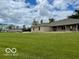 Beautiful home with a large lawn, garage, and brick exterior at 11898 N 200 W, Fountaintown, IN 46130