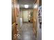Hallway features wood trim, a utility sink, and leads to the laundry room at 11898 N 200 W, Fountaintown, IN 46130