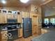 Spacious kitchen featuring custom wood cabinets and modern appliances at 11898 N 200 W, Fountaintown, IN 46130