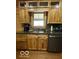 Kitchen featuring wooden cabinets, granite countertops, and stainless steel sink at 11898 N 200 W, Fountaintown, IN 46130
