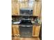 Kitchen featuring wooden cabinets, granite countertops, and stainless steel appliances at 11898 N 200 W, Fountaintown, IN 46130