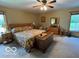 Bright primary bedroom with a ceiling fan, large closet, and a view of the outdoors at 11898 N 200 W, Fountaintown, IN 46130