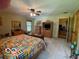 Bright primary bedroom with a ceiling fan, large closet, and a view of the outdoors at 11898 N 200 W, Fountaintown, IN 46130