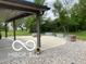 Covered patio area with additional gravel space, ideal for outdoor living and entertainment at 11898 N 200 W, Fountaintown, IN 46130