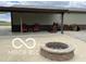 Cozy patio featuring a brick fire pit, seating, and charming string lights for outdoor enjoyment at 11898 N 200 W, Fountaintown, IN 46130