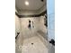 Shower with tile walls, a shower head, and a shower seat at 11898 N 200 W, Fountaintown, IN 46130