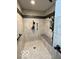 Shower with tile walls, a shower head, and a shower seat at 11898 N 200 W, Fountaintown, IN 46130