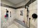 Shower featuring decorative tile, a built-in seat, and modern fixtures at 11898 N 200 W, Fountaintown, IN 46130
