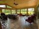 Sunroom with tile floors and a beautiful view of the surrounding landscape at 11898 N 200 W, Fountaintown, IN 46130
