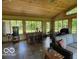 Inviting sunroom with wood ceiling, tiled floors, and natural light throughout at 11898 N 200 W, Fountaintown, IN 46130