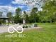 View showcasing the gravel area, yard, and outdoor amenities of the property at 11898 N 200 W, Fountaintown, IN 46130
