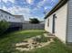 Home's backyard featuring a mix of grass, bare dirt, and a partial fence line at 1420 Wigwam Ln, Martinsville, IN 46151