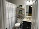 Well-lit bathroom featuring modern fixtures, patterned shower curtain, and stylish decor for a refreshing experience at 1420 Wigwam Ln, Martinsville, IN 46151
