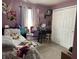 Well-decorated bedroom with a cozy bed, functional desk area, and ample closet space at 1420 Wigwam Ln, Martinsville, IN 46151