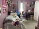 Bright bedroom featuring unique decorations, a cozy bed, and a functional desk space at 1420 Wigwam Ln, Martinsville, IN 46151