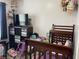 Bright and airy bedroom with a crib and toys, great storage options, ideal for a space at 1420 Wigwam Ln, Martinsville, IN 46151