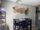 Charming dining area adorned with decorative wall hangings and a table for enjoyable meals and entertaining at 1420 Wigwam Ln, Martinsville, IN 46151