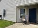 Charming front porch with rocking chair and seasonal decor, creating a welcoming entrance at 1420 Wigwam Ln, Martinsville, IN 46151