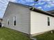 A view of the rear exterior of the home, showing two windows at 1420 Wigwam Ln, Martinsville, IN 46151