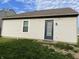A view of the rear exterior of the home, featuring a door and window at 1420 Wigwam Ln, Martinsville, IN 46151