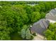 Lush trees surround a home with a spacious backyard, patio seating and meticulous landscaping at 14274 Matt St, Carmel, IN 46033