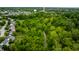 Aerial view showcasing residential area with mature trees, local water tower and winding roads at 14274 Matt St, Carmel, IN 46033