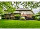Well-manicured backyard boasts a large lawn and a charming deck perfect for outdoor entertaining at 14274 Matt St, Carmel, IN 46033
